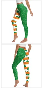 Detail of St. Patrick's Day yoga leggings with green shamrock print and orange stripes