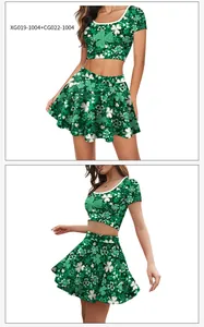 Detail of green St. Patrick's Day outfit with clover print crop top and pleated skirt