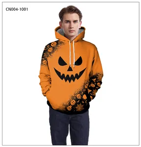 Macro detail of Jack-o'-lantern face and spider web print on orange hoodie