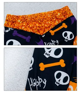 Details von Halloween-Leggings mit Totenkopf-Prints und orangefarbenem Paillettenbund