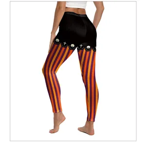Détail de leggings de yoga Halloween avec rayures orange et imprimés citrouilles