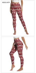 Detail view of red and black plaid Christmas leggings with reindeer and snowflake prints