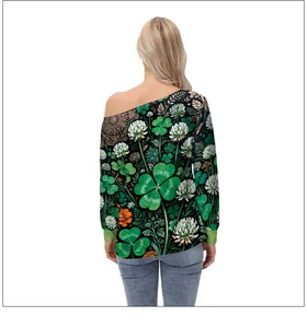 Detail of off-shoulder long sleeve top featuring festive green clover print for women