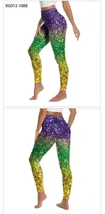 Detail view of colorful gradient yoga leggings with festive golden mask 3D print pattern