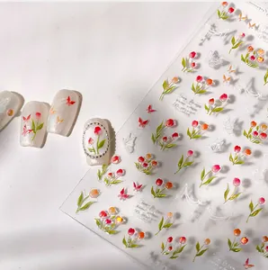 Macro shot of M-129 3D tulip and butterfly nail stickers with finished nail art display