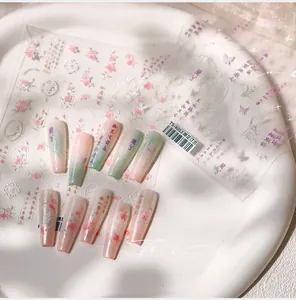 Detailed 5D embossed nail stickers featuring floral patterns and Chinese calligraphy