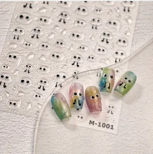 Macro view of M-1001 3D ghost eye nail decals on iridescent cat-eye manicure