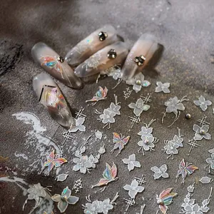 3D embossed nail art stickers with holographic butterflies and white flowers on nails