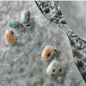 Macro shot of laser star nail art stickers with holographic finish and colored tips