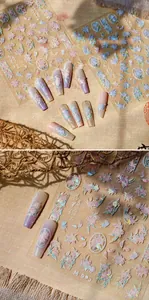 5D embossed nail stickers featuring pink floral patterns and butterfly art details