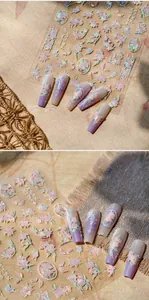 Detail of pink lily nail stickers with elegant calligraphy on transparent jelly base