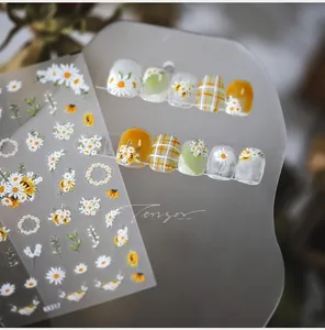Detail of KK317 daisy nail art stickers featuring white flowers and green leaves patterns