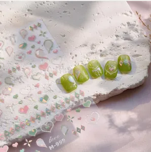 Detail showing heart and bow 3D embossed nail stickers M-999 with glossy gel finish