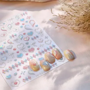 Detail of 3D embossed heart nail stickers with iridescent finish and bow designs