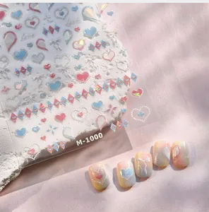 Macro shot of M-1000 embossed nail art stickers with iridescent hearts and bows
