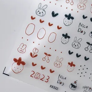 Autocollants à ongles lapin et fraise avec texte Nice Day sur fond blanc épuré