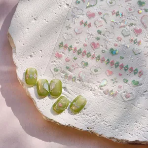 3D heart and bow nail art stickers in pink and green for creative DIY manicure