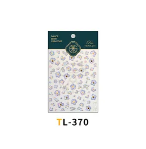 Detail of TL-370 nail stickers with gradient blue flowers and golden accents