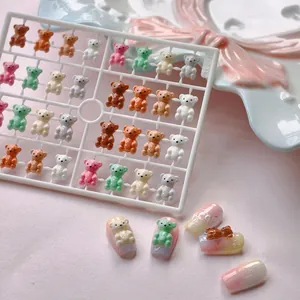 3D resin bear nail art charms in multiple colors on a frame with TX-057 model label
