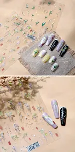 Détails macro d'autocollants 3D muguet sur diverses bases de vernis colorées