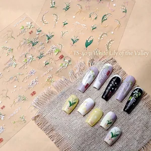 Autocollants ongles 3D muguet blanc avec motifs floraux sur divers ongles d'affichage