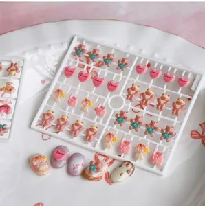 Detailed view of 3D resin nail charms featuring pink bears and hearts, model TX-050