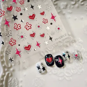 3D gold-stamped heart and star nail stickers with colorful glitter decals on white tray