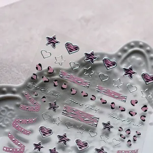 Pink leopard print 3D nail stickers with silver glitter edges and lace bow heart designs
