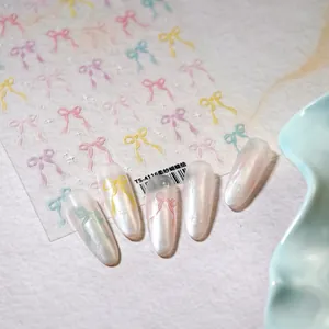 Bow tie nail stickers with sheer pastel colors and pearlescent finish for manicure art