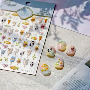 Macro detail of M-1126 embossed nail stickers featuring cute cartoon animals and ice cream