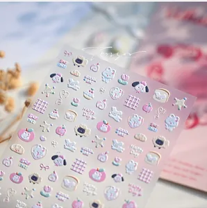 Close-up of 3D embossed cartoon nail art stickers with cute animals and pastel stars