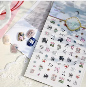 Close-up of cute hand-drawn cat and rabbit nail art stickers with decorative lace backdrop