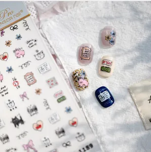 Detailed view of hand-drawn cat and rabbit nail stickers with floral doodle elements