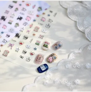 Detail of M-1189 nail art stickers with hand-drawn cats, bows and cherry patterns
