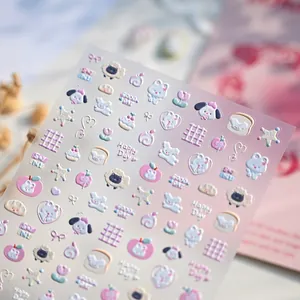 3D embossed cartoon nail stickers featuring cute animals and pastel stars on adhesive sheet