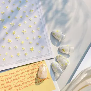 Elegant daisy nail stickers with KX477 floral designs and botanical shadow background