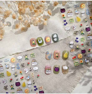 Detailed view of hand-drawn cat and duck nail art stickers in macaron colors