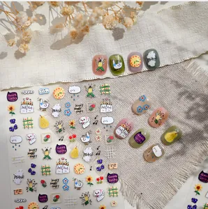 Detail of cute panda cat nail stickers with hearts, rainbow graffiti and animal patterns