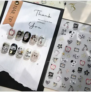 Detail of 3D embossed nail stickers featuring cute dog, cat, and heart patterns