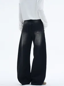Retro washed black wide-leg denim jeans with deconstructed silhouette and back pockets