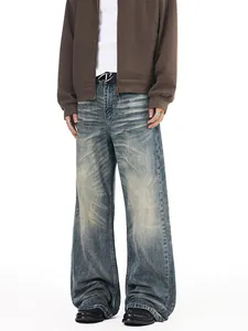 Men's vintage washed blue wide-leg jeans with whiskering and oversized baggy silhouette