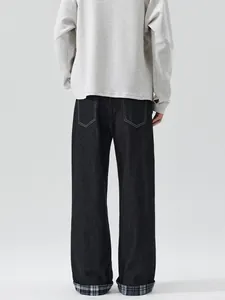 Men's loose straight black jeans featuring stylish grey plaid cuffed hems and workwear style