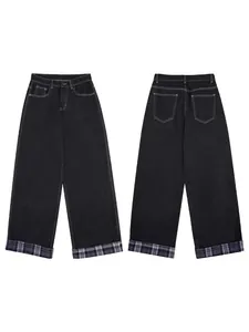 Loose dark gray denim trousers with contrast stitching and plaid patchwork cuffs