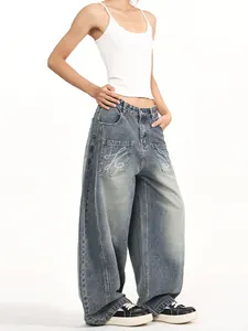 Baggy oversized vintage wash denim jeans with laser print pockets and high-waist drape fit