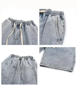 Detailed views of light blue washed denim shorts with elastic drawstring waist and pockets