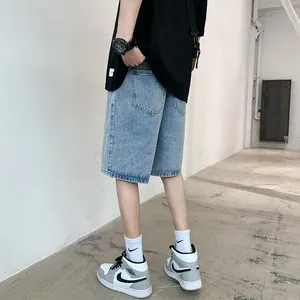 Men's loose fit light blue denim shorts with elastic waist in a street style fashion