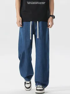 Pantaloni jeans uomo blu scuro gamba dritta con coulisse in vita e stile street casual