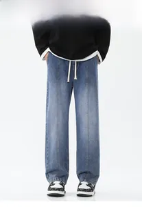 Détails du jean délavé vintage avec cordon à la taille et plis cousus sur le devant