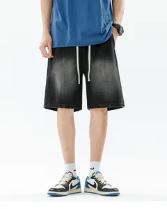 Detailed close-up of retro gradient washed denim shorts with white drawstring and topstitching