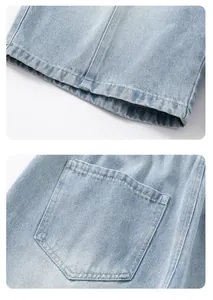 Detailed macro shot of light wash denim fabric with precise stitching on hem and pocket